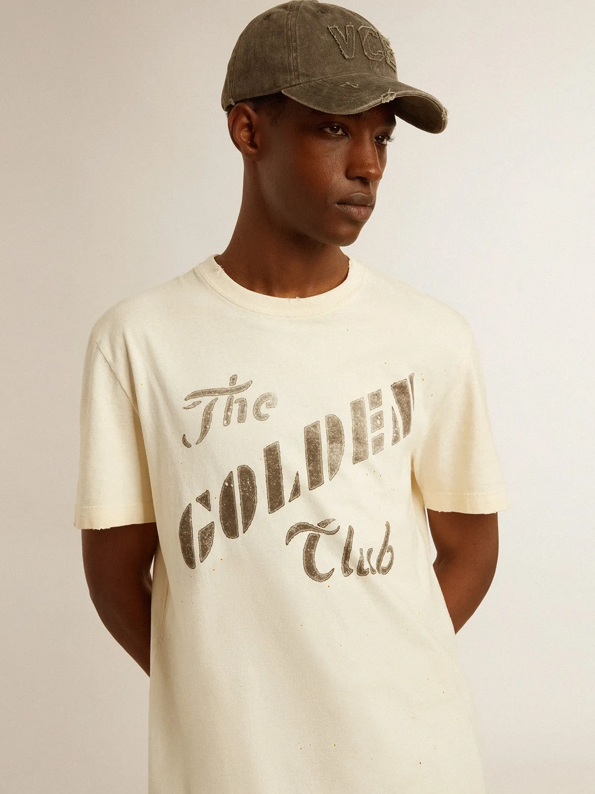 Men's aged white cotton T-shirt with gold print