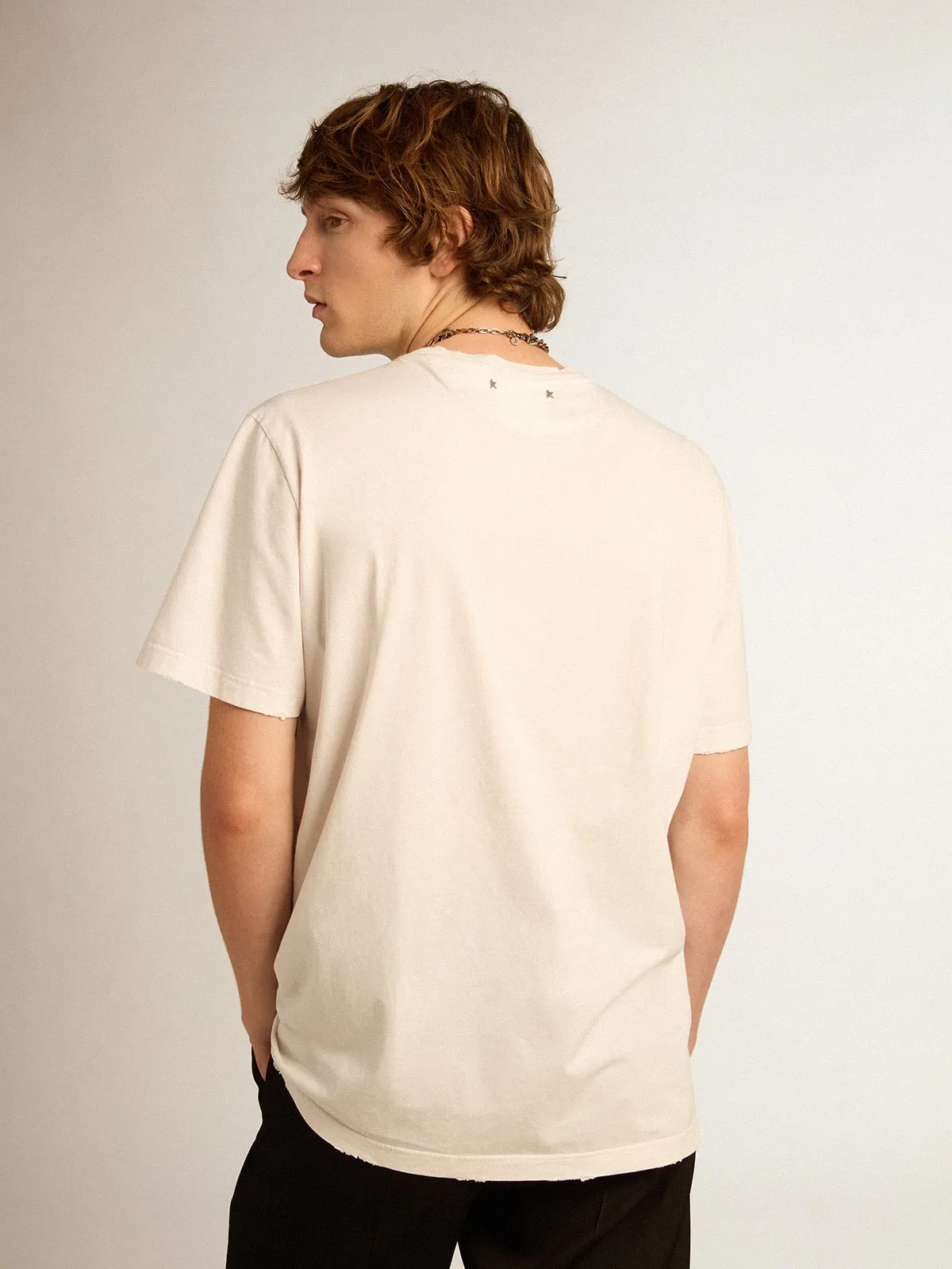 Men's white T-shirt with distressed treatment